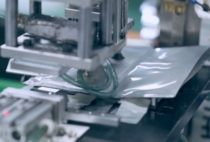 Automatic Taping After Top Sealing